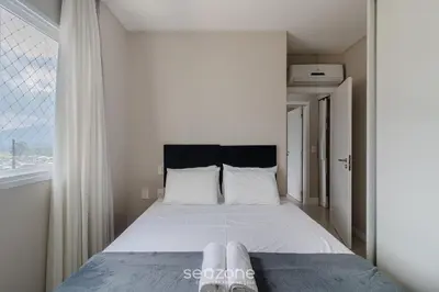 Uma cama ou camas num quarto em Apto 3 Suites a 600m da praia em Porto Belo PDP904