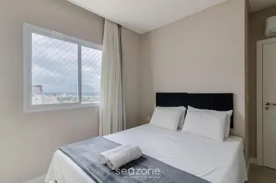 Uma cama ou camas num quarto em Apto 3 Suites a 600m da praia em Porto Belo PDP904