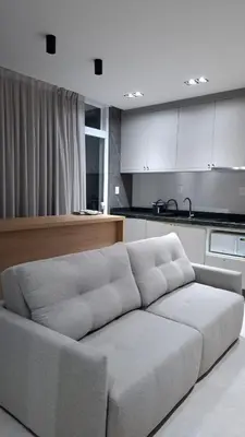 Uma área de estar em Apartamentos Elegance