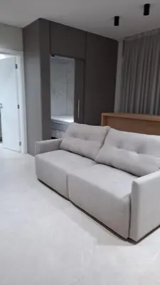 Uma área de estar em Apartamentos Elegance