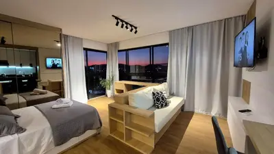 Uma cama ou camas num quarto em CURTA! |165| Lindo Studio | Próx Centro de Eventos