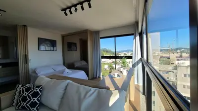 Uma cama ou camas num quarto em CURTA! |165| Lindo Studio | Próx Centro de Eventos