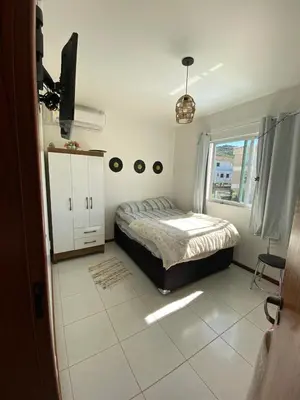 Uma cama ou camas num quarto em Apartamento Vitoria