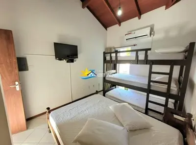 Uma cama ou camas num quarto em Lindo Sobrado à 220m Praia do Mariscal