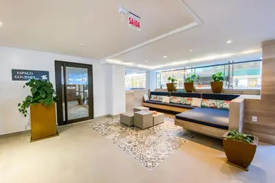 Uma área de estar em Apartamento em home clube
