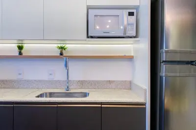 A cozinha ou kitchenette de Apartamento em home clube