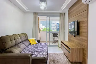 Uma televisão e/ou sistema de entretenimento em Apto Luxuoso com 3 Suítes - 0312