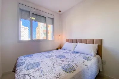 Uma cama ou camas num quarto em Viva o Paraíso Apto na Praia de Palmas - 0221