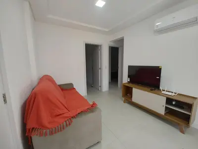 Uma televisão e/ou sistema de entretenimento em Apto 290m da Praia de Palmas - 0327
