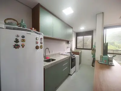 A cozinha ou kitchenette de Apto metros da Praia de Palmas - 0229