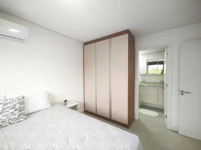Uma cama ou camas num quarto em Apto metros da Praia de Palmas - 0229