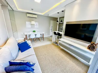 Uma televisão e/ou sistema de entretenimento em Apto 100m da Praia de Palmas - 0330