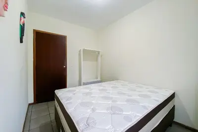 Uma cama ou camas num quarto em Apartamento com vista mar - 0332