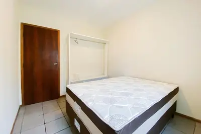 Uma cama ou camas num quarto em Apartamento com vista mar - 0332