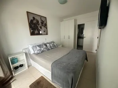 Uma cama ou camas num quarto em Apartamento para férias na Praia de Palmas - 0235