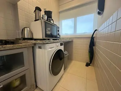 A cozinha ou kitchenette de Apartamento para férias na Praia de Palmas - 0235