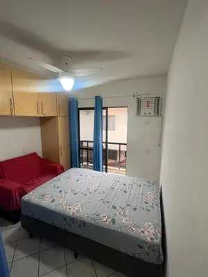 Uma cama ou camas num quarto em Sobrado Centro de bombinhas 50 m do mar com 02 suítes