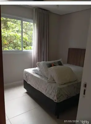 Uma cama ou camas num quarto em Aconchegante Apartamento na praia de Palmas, 2 quartos