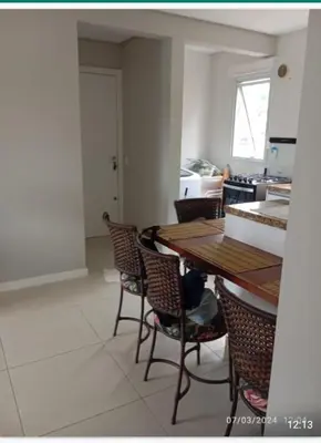 Uma área de estar em Aconchegante Apartamento na praia de Palmas, 2 quartos