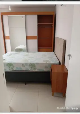 Uma cama ou camas num quarto em Aconchegante Apartamento na praia de Palmas, 2 quartos