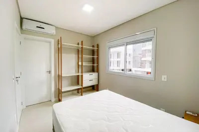 Uma cama ou camas num quarto em Descanso e conforto a 450m da Praia de Palmas 0102
