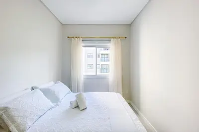 Uma cama ou camas num quarto em Apto no paraíso, conheça praia de Palmas - 0115