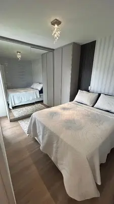 Uma cama ou camas num quarto em Apartamento Vista Mar - Área de Lazer - Poucos Minutos do Mar