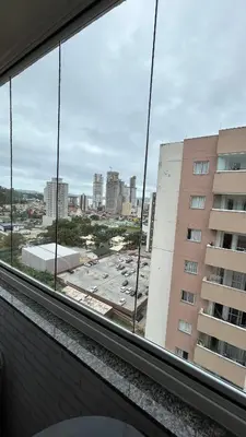 Uma vista geral de Itapema ou a vista da cidade a partir do apartamento