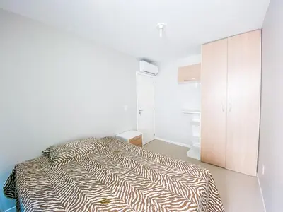 Uma cama ou camas num quarto em Praia de Palmas 300m do Mar na Avenida - 0414
