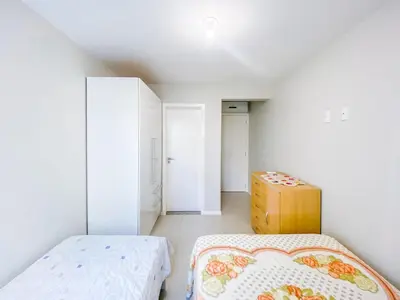 Uma cama ou camas num quarto em Praia de Palmas 300m do Mar na Avenida - 0414