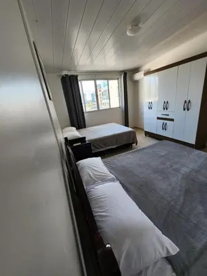 Uma cama ou camas num quarto em Cobertura há 150 metros do mar - 0412