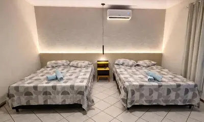 Uma cama ou camas num quarto em Kit Net Meia Praia Itapema - SC