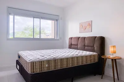 Uma cama ou camas num quarto em Apto em condomínio completo em Palmas - 0418