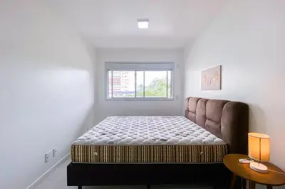 Uma cama ou camas num quarto em Apto em condomínio completo em Palmas - 0418