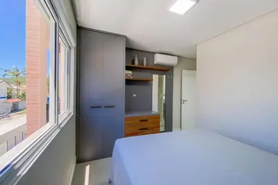 Uma cama ou camas num quarto em Apto novo há poucos metros do mar em Palmas - 0424