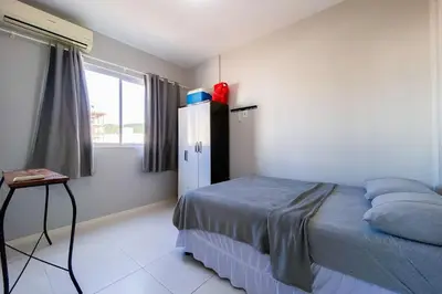 Uma cama ou camas num quarto em Palmas, 500m Apto Cheio de Personalidade - 0429