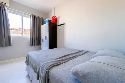 Uma cama ou camas num quarto em Palmas, 500m Apto Cheio de Personalidade - 0429
