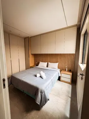 Uma cama ou camas num quarto em Triplex 3850 - Suítes