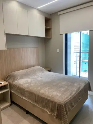 Uma cama ou camas num quarto em Triplex 3850 - Suítes