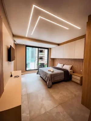 Uma cama ou camas num quarto em Triplex 3850 - Suítes