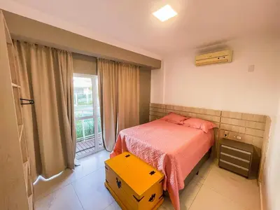 Uma cama ou camas num quarto em Apto térreo com 02 quartos na Praia de Palmas - 0434