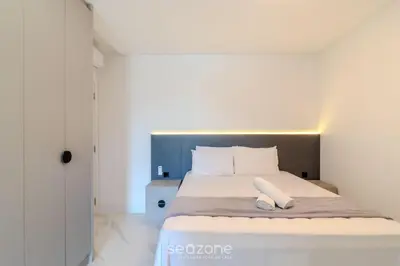 Uma cama ou camas num quarto em Apto c/ Churrasqueira a 250m da Praia MTR1703