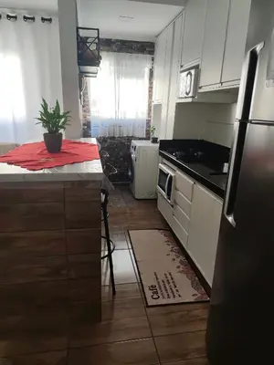 A cozinha ou kitchenette de Apt confortável