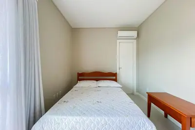 Uma cama ou camas num quarto em Curta a Praia de Palmas a 450m do mar! - 0323