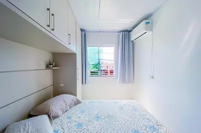 Uma cama ou camas num quarto em Praia de Palmas - Próximo à Vila Gastronômica - 0469