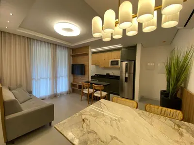Uma televisão e/ou sistema de entretenimento em Praia de Palmas, 450m da Praia, Novo e Garden - 0472