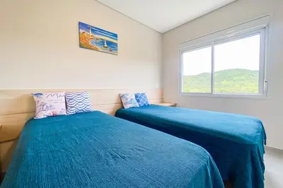 Uma cama ou camas num quarto em Praia de Palmas, 480 metros do mar - 0473