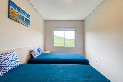 Uma cama ou camas num quarto em Praia de Palmas, 480 metros do mar - 0473