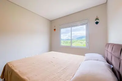 Uma cama ou camas num quarto em Praia de Palmas, 480 metros do mar - 0473