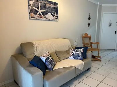 Uma área de estar em Apartamento em Itapema